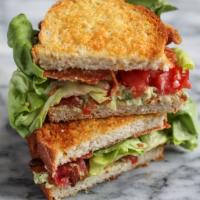 BLT  Sandwich · Crispy apple wood smoked bacon, lettuce and fresh tomato served on sour dough bread.