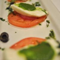 Mozzarella di Bufala con Mojo de Cilantro · Fresh mozzarella di Bufala in a cilantro and green pepper marinade. Uncommonly good tapa. Th...