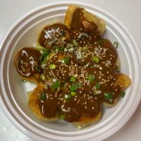 Pork Wonton with Spicy Sesame Sauce芝麻肉云吞 · 8 pieces. Pan-fried or steamed. Stuffed Chinese dumpling with pork. Hot and spicy.