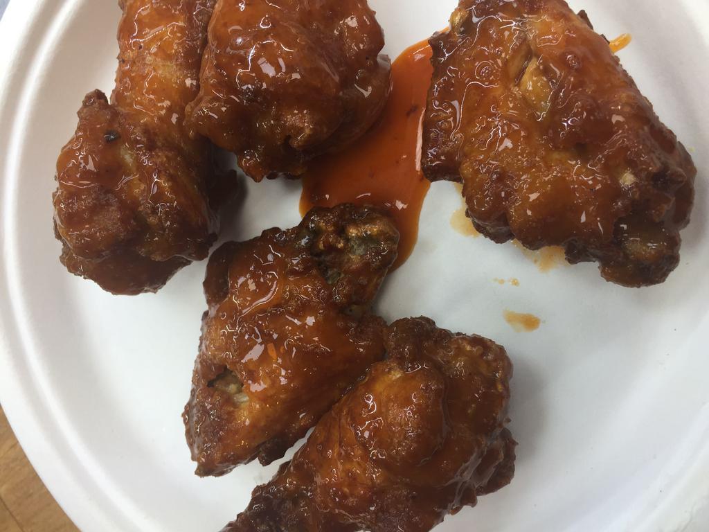 Buffalo Wings · Five pieces. Served with blue cheese.
