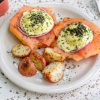 Smoked Benny Benedict · Two poached eggs on a toasted bagel with cream cheese, smoked salmon, onions, capers and our...