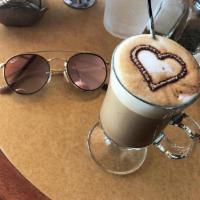 Cafe Demetrio · With secret cacao powder and milk, a double shot of espresso and a bit of sugar to sweeten i...
