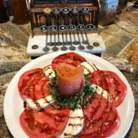 Caprese Salad · Slices of fresh mozzarella cheese, ripe tomatoes and fresh basil, drizzled with olive oil an...