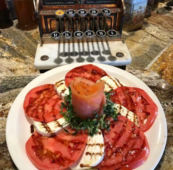 Caprese Salad · Slices of fresh mozzarella cheese, ripe tomatoes and fresh basil, drizzled with olive oil and balsamic vinegar.