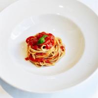Ferretto allo Spugnito di Pomodoro · Homemade fresh spaghetti with cherry tomato sauce and fresh basil. Vegetarian.