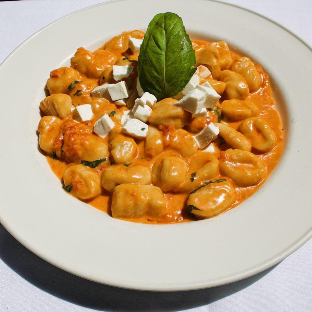Gnocchi di Patate alla Sorrentina · Potato gnocchi in a light tomato sauce, with fresh mozzarella cheese, Vegetarian.