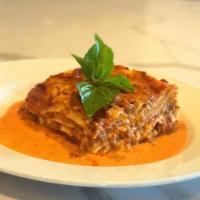 Lasagna Pasticciata · Homemade pasta, ground beef ragout, tomato, béchamel sauce