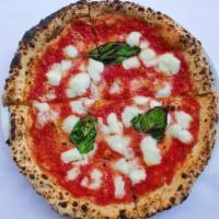 Margherita Pizza · Mozzarella Fior di latte, tomato sauce and basil.