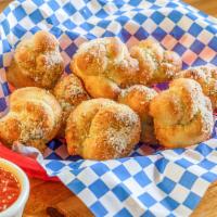 Garlic Knots · Comes with a side of Rudy's red sauce.
