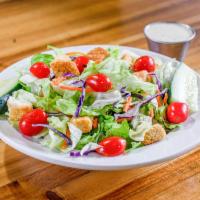 Vegan Dinner Salad · Chopped iceberg and romaine lettuce, Roma tomatoes, vegan croutons shredded carrots and purp...