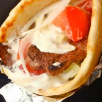 Lamb Gyro · Grilled Lamb and Salad in toasted pita topped with homemade Taziki sauce (White Sauce)