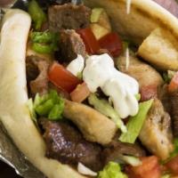 Combo Gyro · Grilled Chicken, Lamb and Salad in toasted pita topped with homemade Taziki sauce (White Sau...