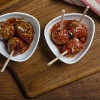 House-Made Meatballs · 2 of our house-made, quarter-pound meatballs with our own marinara and dipping bread.