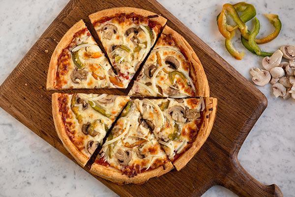 Veggie Gluten-Free Crust Pizza · Mushrooms, onions, peppers, mozzarella cheese, Romano cheese, and tomato sauce.
