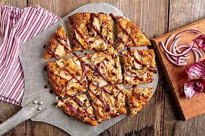 BBQ Chicken Pizza · Sliced chicken, red onions, citrus BBQ sauce, and a blend of cheeses.