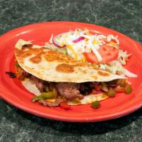 Quesadilla Fajita · A flour tortilla stuffed with strips of chicken or beef grilled with onions, tomatoes, bell ...