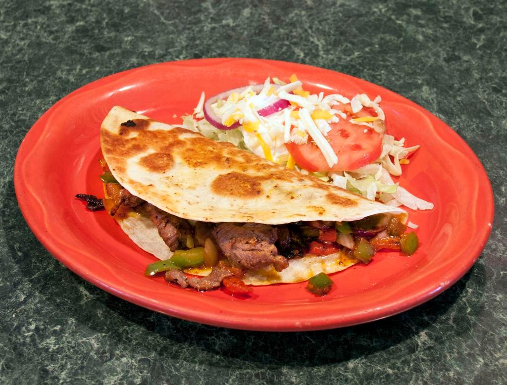 Quesadilla Fajita · A flour tortilla stuffed with strips of chicken or beef grilled with onions, tomatoes, bell peppers and cheese. Served with a side of lettuce, sour cream and tomatoes.