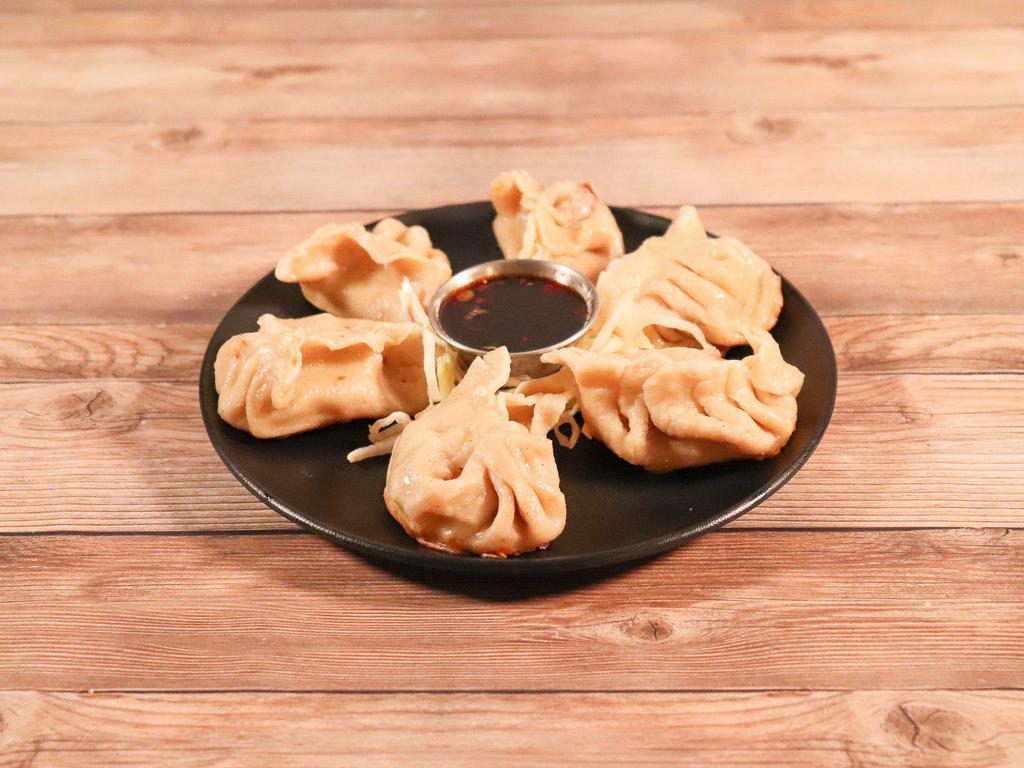 13. Dumplings · 6 pieces. Your choice of pan-fried or steamed dumplings. One order comes with 6 pieces.