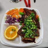 Angus Short Ribs Plate · Tender Marinated short ribs charbroiled to perfection and served over white or brown rice. A...