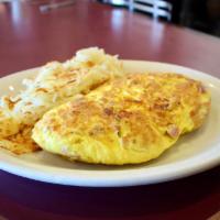 Ham and Cheese Omelet · Served with American cheese and ham. Includes a side of hash brown or fruit and pancakes or ...