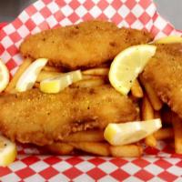 Fish and fries · 3 piece code fish serves with fries and soda as well as tarter sauce.