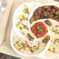 Mixed Appetizers · Hummus, baba ghanoush, labne, eggplant salad and grape leaves.