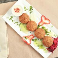 Falafel · Ground chickpeas, garlic, onion and parsley mixed with our Mediterranean herbs.