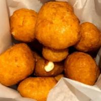 Fried Cheese Curds · White cheddar cheese curds, beer battered and deep fried. Served with ranch.