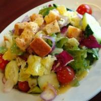 Dinner Salad · Mixed greens, tomato, red onion, cucumber, shredded cheddar-jack cheese, and croutons.