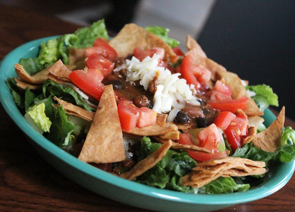 Taco Salad Combo · Seasonal greens, chili, tomato, cheddar, chipotle dressing and tortilla chips. Includes a drink and choice of side.