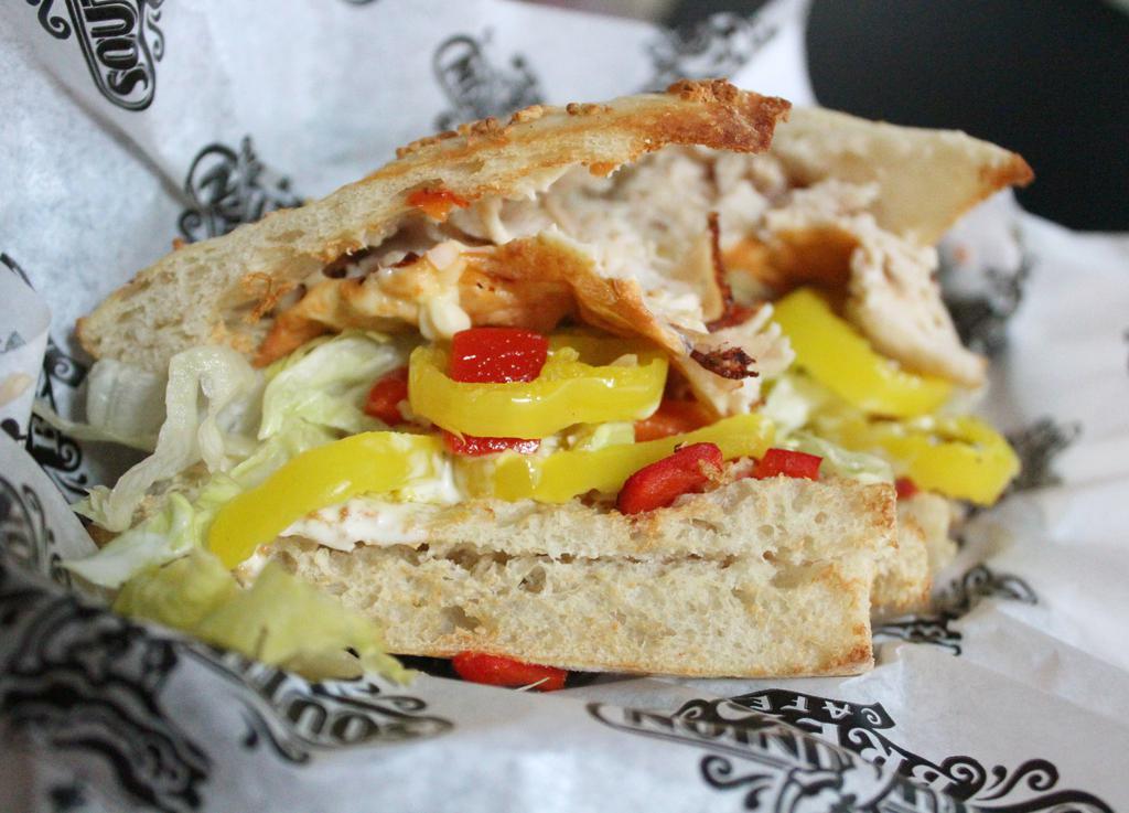 Triple Pepper Turkey Hot Sandwich · Turkey, pepper jack cheese, roasted red pepper, lettuce, banana pepper rings and creamy parmesan dressing on focaccia.