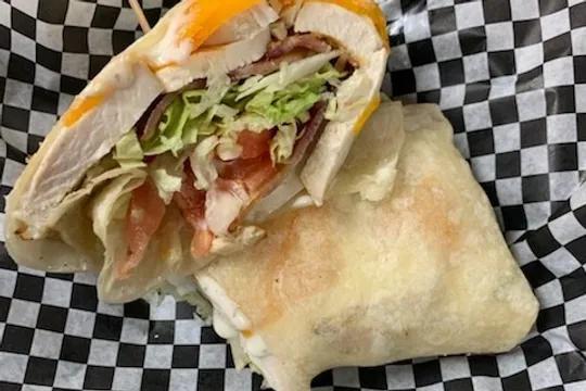 Chicken Bacon Ranch Wrap · Our fresh roasted chicken with cheddar cheese, applewood smoked bacon, fresh lettuce and tomato and tangy Ranch wrapped in a warm tortilla.