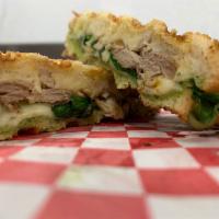 Turkey, Basil Pesto, Spinach, Parmesan Panini · Fresh Turkey, Basil Pesto, fresh Spinach and shaved Parmesan Cheese on our buttered rustic P...