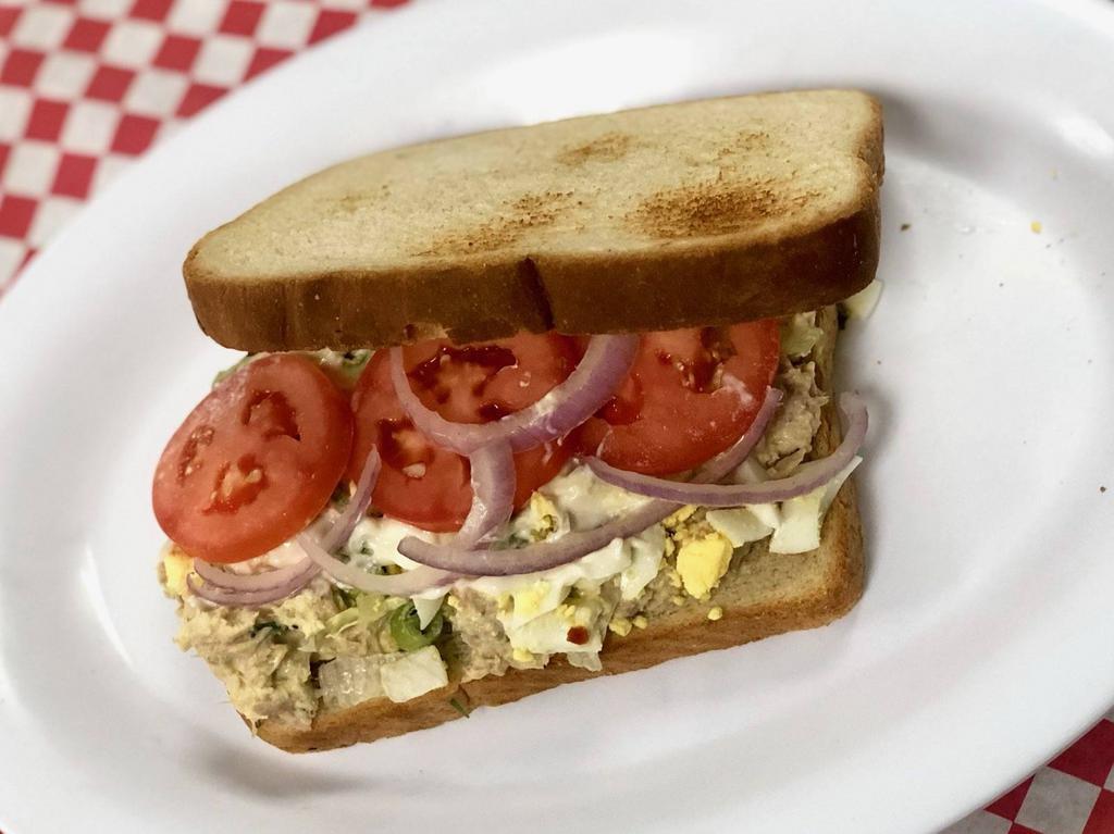 Tuna Salad Sandwich · NOTHING CAN BE TAKEN OFF THIS SANDWICH EXCEPT FOR LETTUCE AND TOMATOES
Albacore tuna, mayo, mustard, green onion, eggs, sugar, red wine vinegar, salt and pepper, lettuce, tomato, and onion.