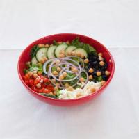 Mediterranean Salad · Greens, cucumbers, chopped onions, roasted red peppers, feta, olives, and chickpeas.