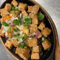 Sizzling tofu · Fried tofu with mayonnaise top with bell pepper and green onions