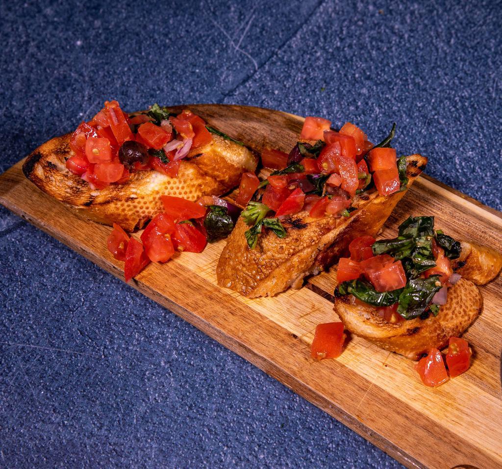 Bruschetta · Toasted bread, chopped tomatoes, black olives, onions and basil.