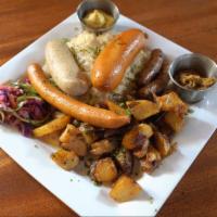 Bavarian · A tasty assortment of German sausages. Nurnberger, Weisswurst and Knockwurst served with sau...
