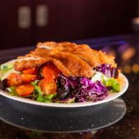 Schnitzel Salad · Mixed greens, cucumbers, tomatoes, onions, carrots topped with your choice of schnitzel. Ser...