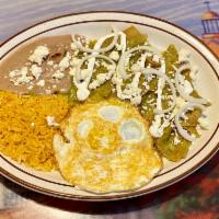 83. Spicy Chilaquiles · Tortillas Chips simmered in red or 
green salsa.with rice and beans topped with 
sour cream,...