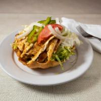 15. Grilled Chicken Salad · Crispy flour tortilla bowl filled with grilled chicken, lettuce, onions, bell peppers, and g...