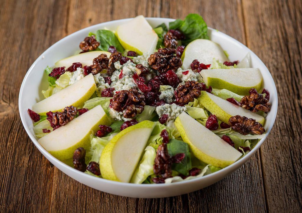 Harvest Salad · Romaine & iceberg lettuce, spinach leaves, sliced fresh pear, craisins, candied walnuts & bleu cheese crumbles with apple cider vinaigrette dressing.