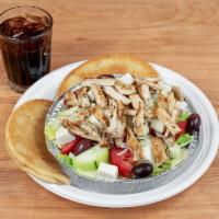 Greek Chicken Salad · Served with lettuce, tomato, cucumber, feta cheese, Greek olives, onions, and dressing. It a...