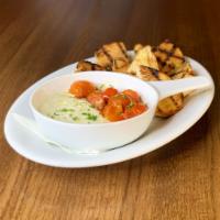 Roasted Tomato & Whipped Feta · bite size tomatoes roasted with garlic & accompanied by whipped feta. served with grilled ba...