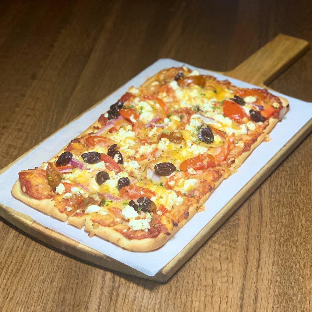 Mediterranean Flatbread · flatbread brushed with garlic butter and baked with tomato sauce, garlic marinated tomatoes, mixed cheese, feta, onion, red bell peppers & kalamata olives