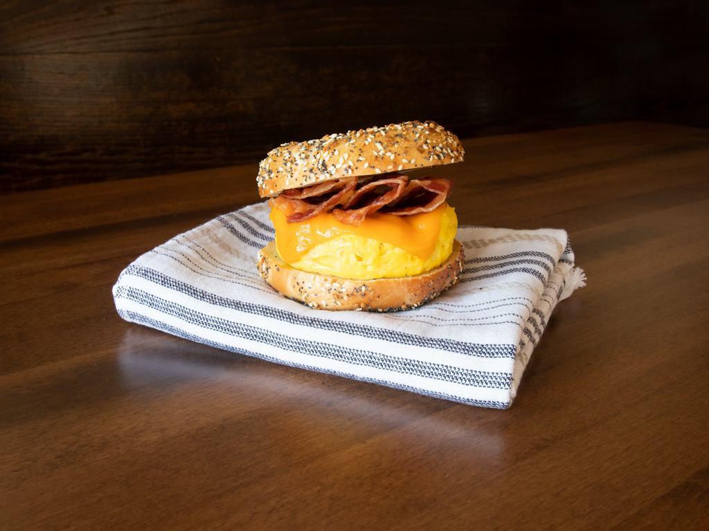 Bacon Breakfast Sandwich · Crispy smoked bacon slices, scrambled egg, cheddar cheese, salt and pepper