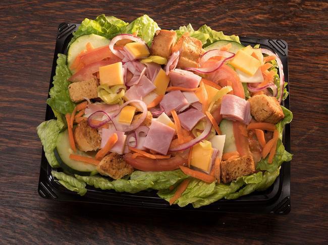 Chef Salad · Ham, turkey, cheddar, swiss, tomato, red onions, carrots, cucumber, pepperoncini, croutons, bacon bits, on a bed of romaine, with your choice of dressing.
