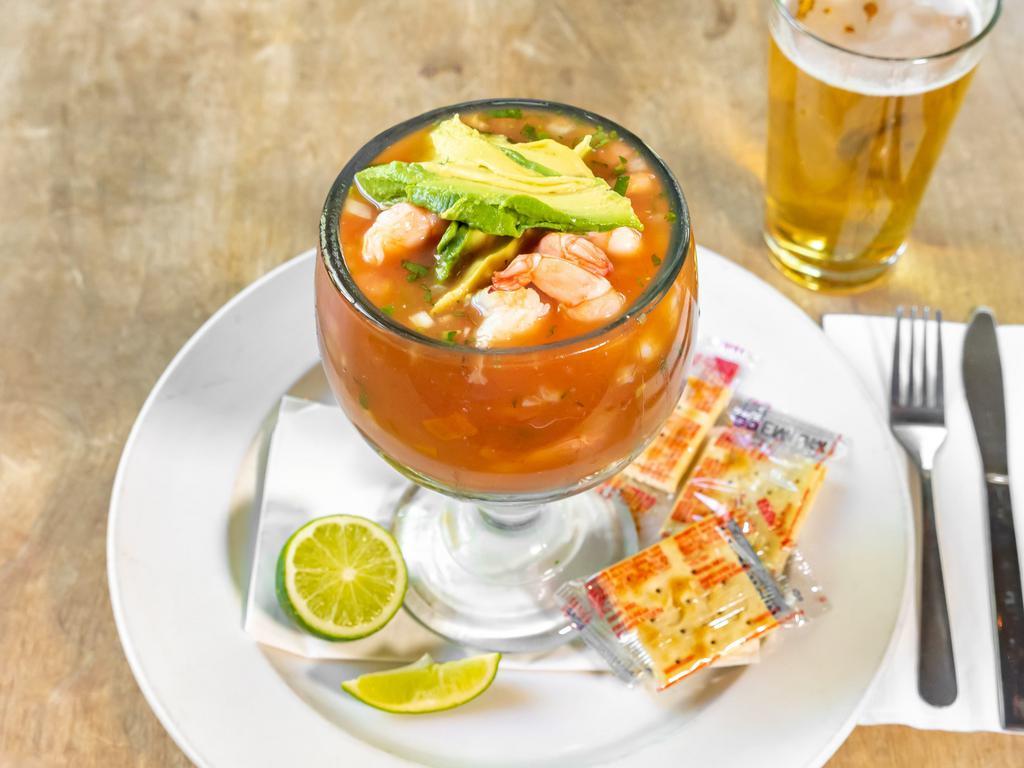Coctel de Camaron · Shrimp in a special cocktail sauce with red onion, tomato, avocado, cilantro and lime juice.