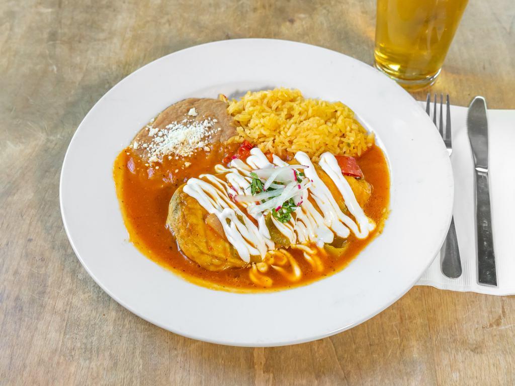 Chile Relleno Platillo · Traditional poblano Chile stuffed with your choice of cheese and mushrooms or chicken and cheese, tipped with our authentic sauce. Served with rice and beans.