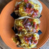 Breakfast Tacos  · Crispy potatoes, scrambled eggs, cheddar jack, pico de gallo, chipotle aioli.